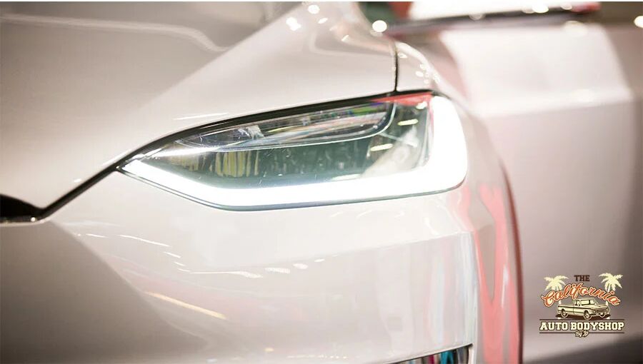 Collision repair detail work on a Tesla